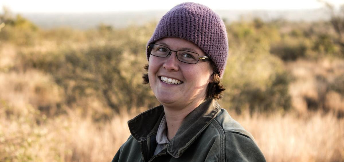 person in stocking cap with grasslands behind 