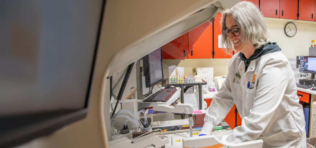 Technician works in clinical pathology laboratory.