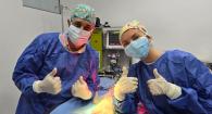 Veterinarian and vet student during a surgery on a dog.