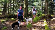 Dr. Brianna Beechler and friend Brian Dugovich on a trail run with Beechler’s dogs Pippin (left) and Jada.