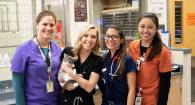 Dr. Ingrid Balsa, Dr. Bianca Reyes, Dr. Brea Sandness, veterinary student Sean Calalang and Mulan the kitten in the small animal clinic.