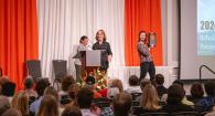 Dr. PK receives her award on stage