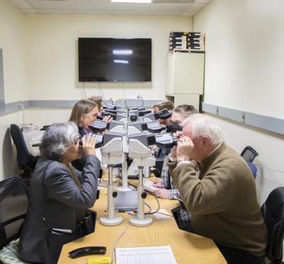 OVDL workers looking in microscopes