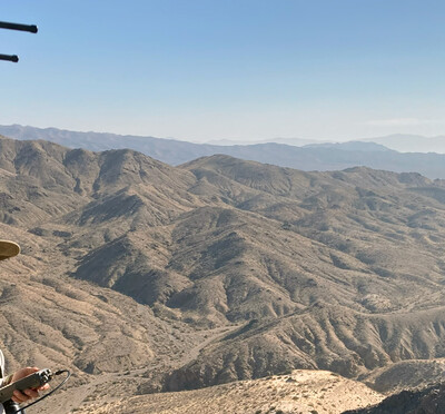 Anna Jolles holds an antenna in the Mojave desert to track bighorn sheep.