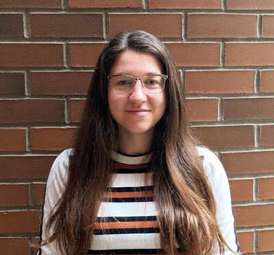 Dr. Nightengale portrait in front of brick wall. 