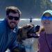 Two people and a dog on a beach at the Oregon Coast