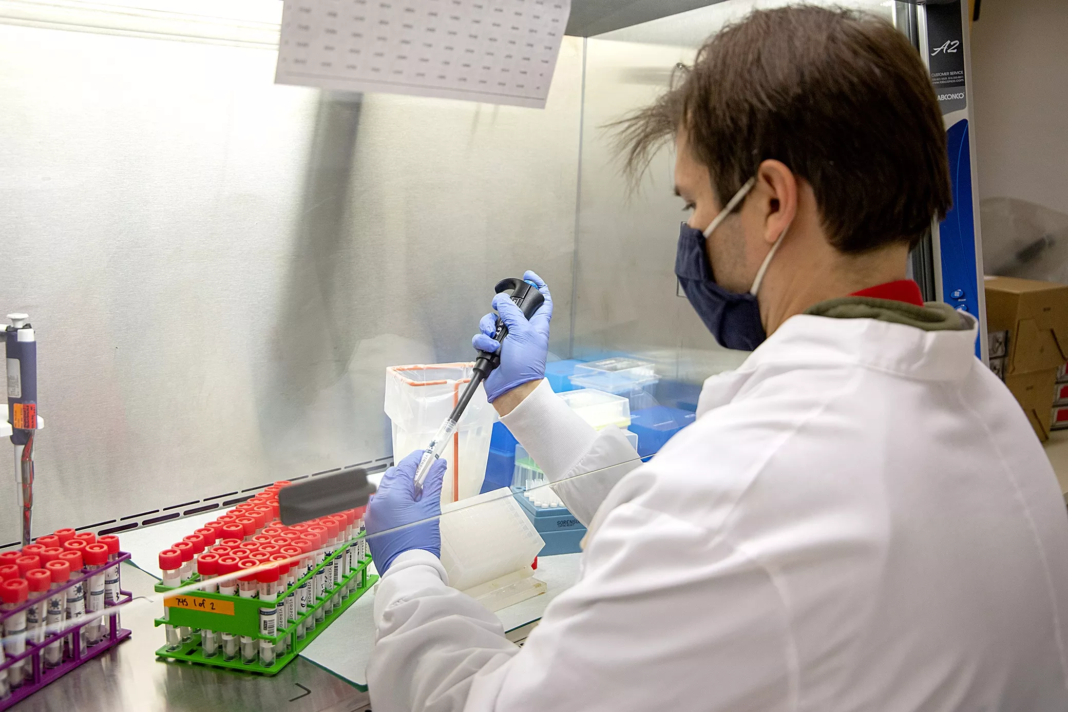 Scientist pipetting