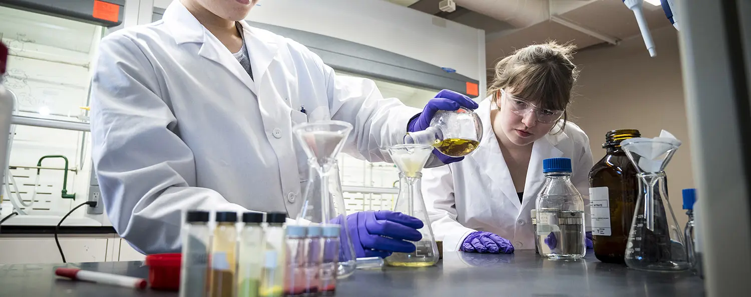 Students mixing chemicals