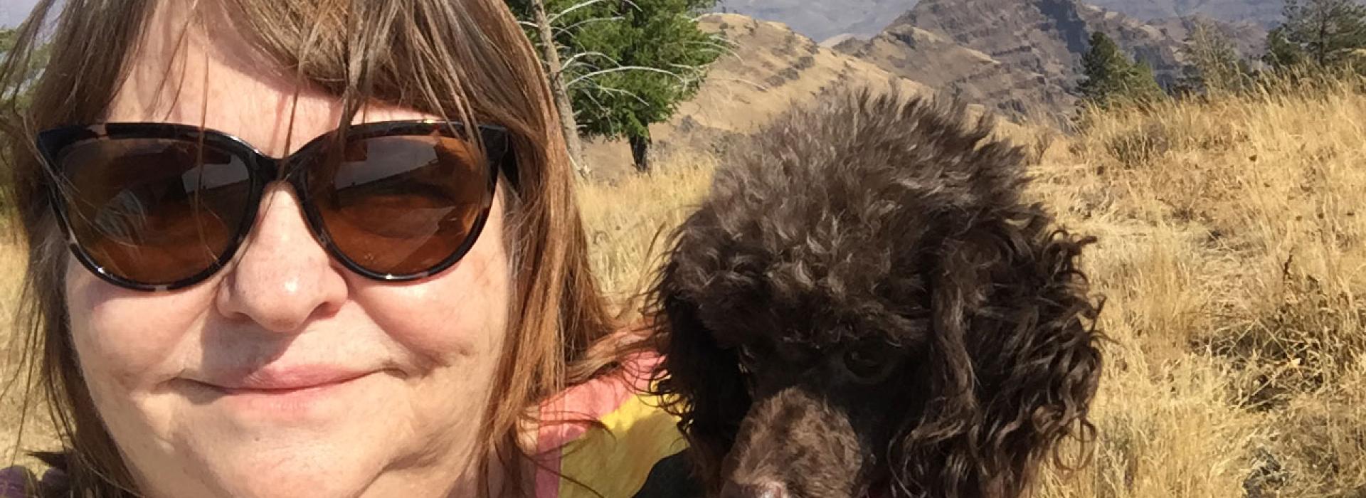 Melanie Garrett, certified veterinary technician, and her dog Madeline near Joseph, Oregon.