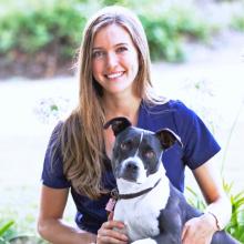 Portrait of Marie and dog outside. 