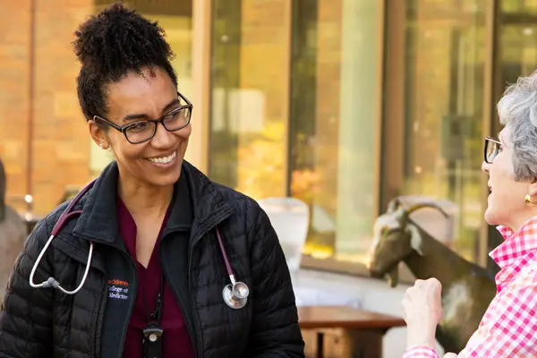 Dr Ngwenyama and Rebecca Camden outside Carlson College of Veterinary Medicine