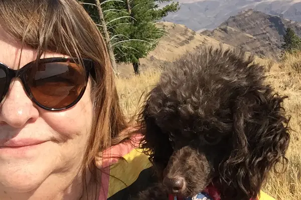 Melanie Garrett, certified veterinary technician, and her dog Madeline near Joseph, Oregon.