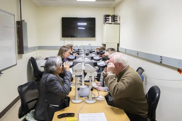 OVDL workers looking in microscopes