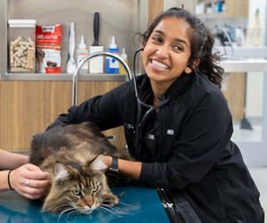 Woman smiling with a cat