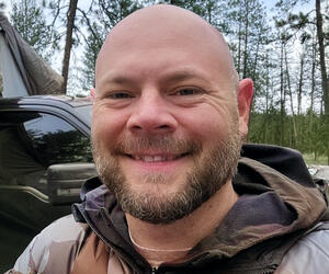 Man smiling outdoors