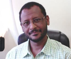 Man smiling with glasses