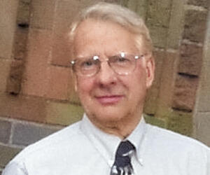 Man smiling with glasses