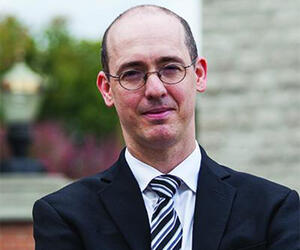 Man smiling with glasses