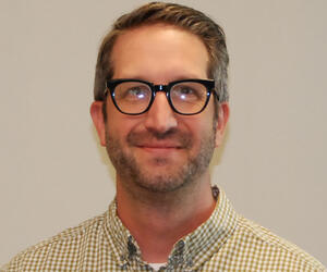 Man smiling with glasses