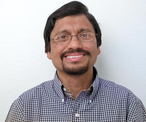 Man smiling with glasses