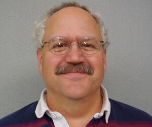 Man smiling with glasses