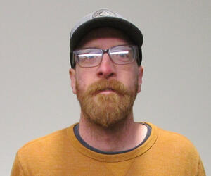 Man smiling with glasses