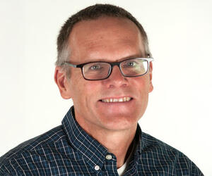Man smiling with glasses