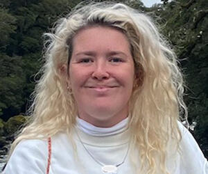 Woman with blond hair smiling