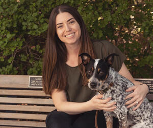Woman smiling with a dog