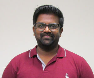 Man smiling with glasses