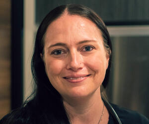 Woman smiling.