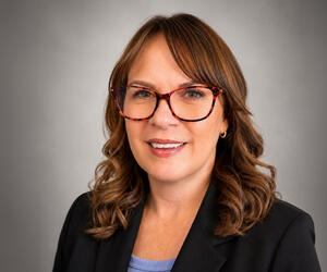 Formal portrait of Kelly Warner.